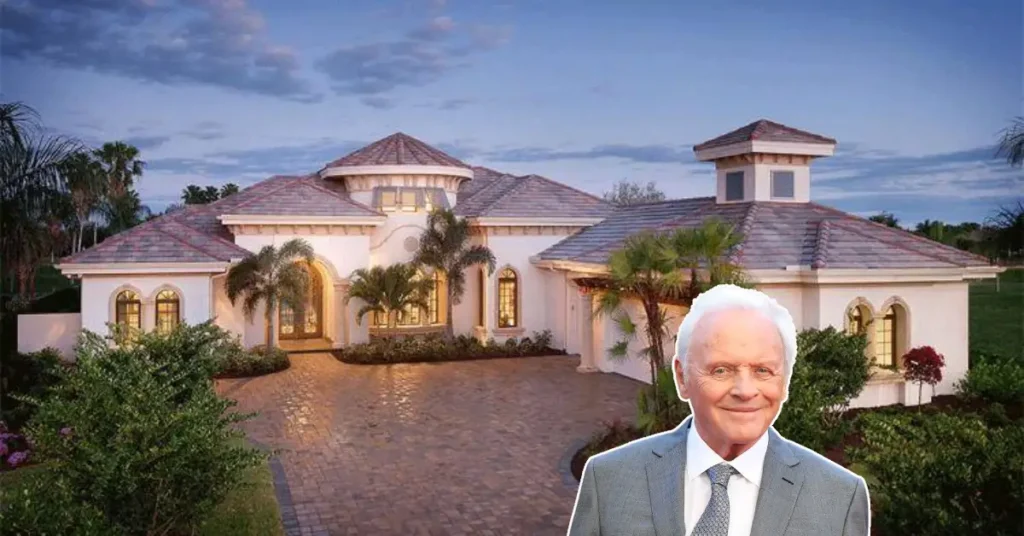 A wide shot of the luxurious Anthony Hopkins House in Malibu, showing Cape Cod-style architecture, ocean views, and elegant outdoor features.