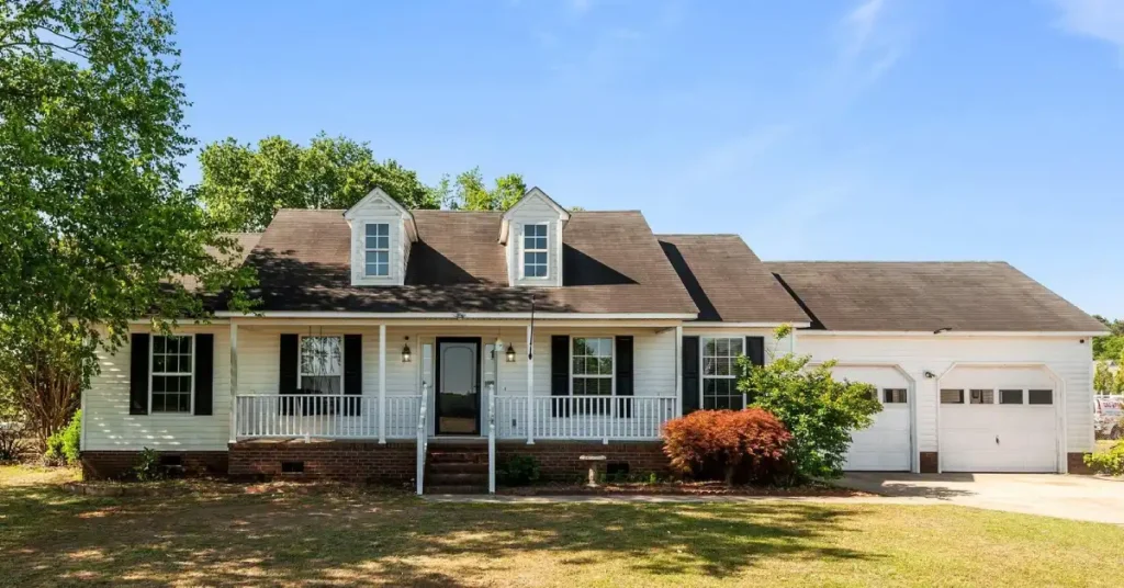 Front view of Jeff Hardy House, showcasing its unique architecture, lush surroundings, and the personal style of the wrestling superstar.